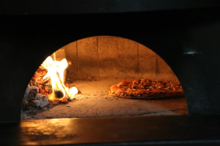 A close up of a pizza in an oven
